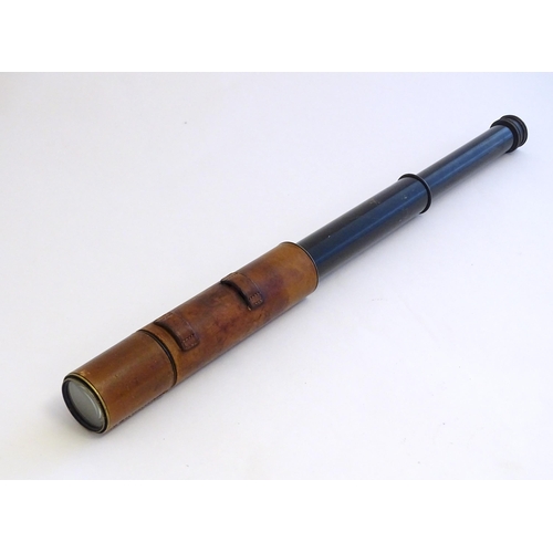 1209 - An early to mid 20thC three-drawer telescope with leather cover and blacked brass finish, stamped J.... 