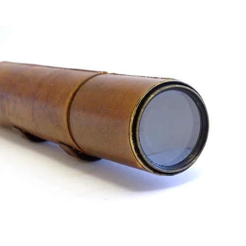 1209 - An early to mid 20thC three-drawer telescope with leather cover and blacked brass finish, stamped J.... 