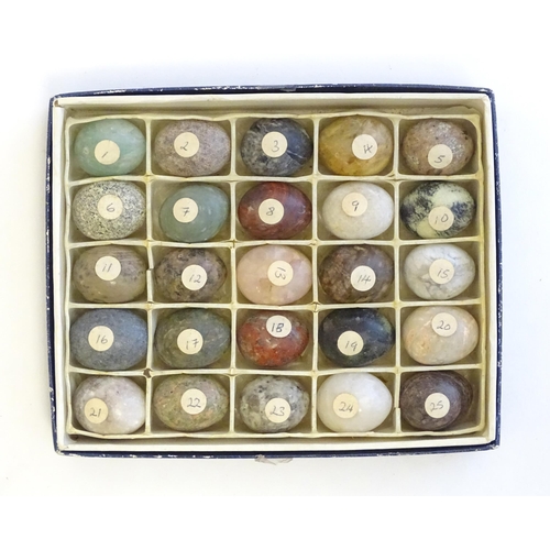 1213 - A collection of 25 specimen models of eggs to include rose quartz, red jasper, verdite, fern stone, ... 