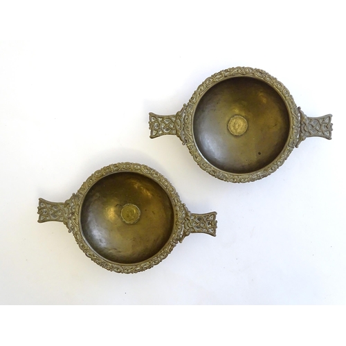 1215 - A pair of Scottish brass quaich with Celtic decoration and inset 1943 threepence coin. Approx. 7 3/4... 