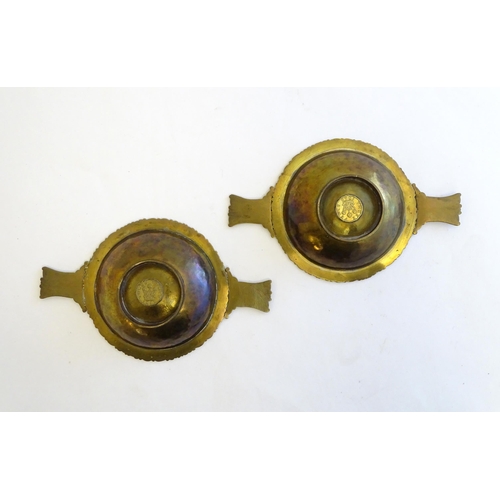 1215 - A pair of Scottish brass quaich with Celtic decoration and inset 1943 threepence coin. Approx. 7 3/4... 