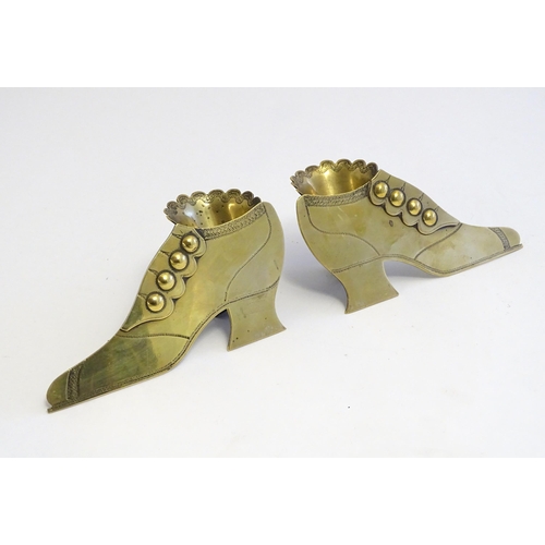 1222 - A pair of Victorian brass novelty posy holders formed as shoes. Approx. 2 1/2