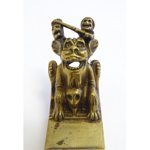 1223 - An early 20thC cast door knocker / tapper with relief decoration of the York Imp, modelled on the Yo... 