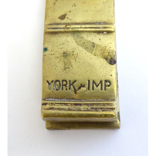 1223 - An early 20thC cast door knocker / tapper with relief decoration of the York Imp, modelled on the Yo... 