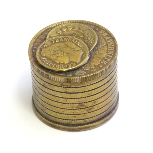 1230 - A 20thC Continental cast inkwell modelled as stacked coins, with applied French coins to top. Approx... 