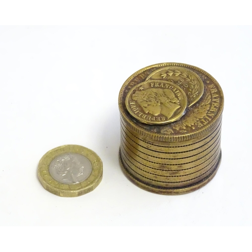 1230 - A 20thC Continental cast inkwell modelled as stacked coins, with applied French coins to top. Approx... 