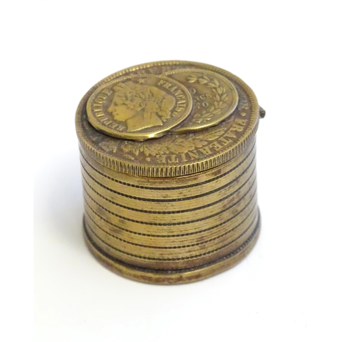 1230 - A 20thC Continental cast inkwell modelled as stacked coins, with applied French coins to top. Approx... 