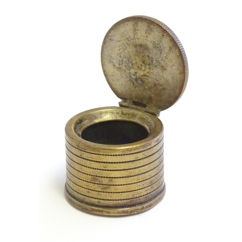 1230 - A 20thC Continental cast inkwell modelled as stacked coins, with applied French coins to top. Approx... 