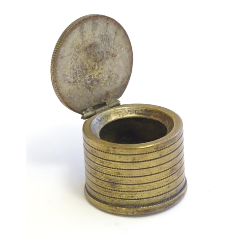 1230 - A 20thC Continental cast inkwell modelled as stacked coins, with applied French coins to top. Approx... 