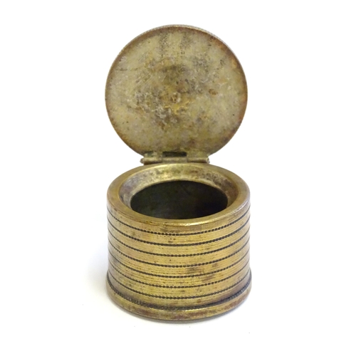 1230 - A 20thC Continental cast inkwell modelled as stacked coins, with applied French coins to top. Approx... 