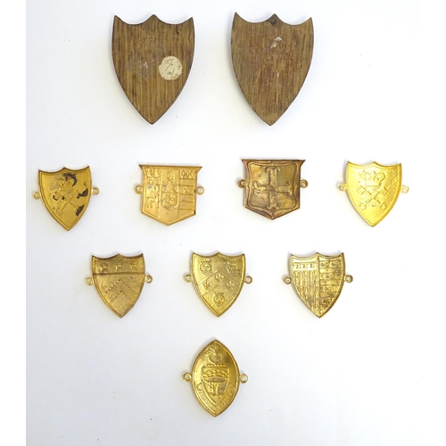 1232 - A collection of gilt metal enamelled collegiate insignia / badges, to include Keble College Oxford, ... 