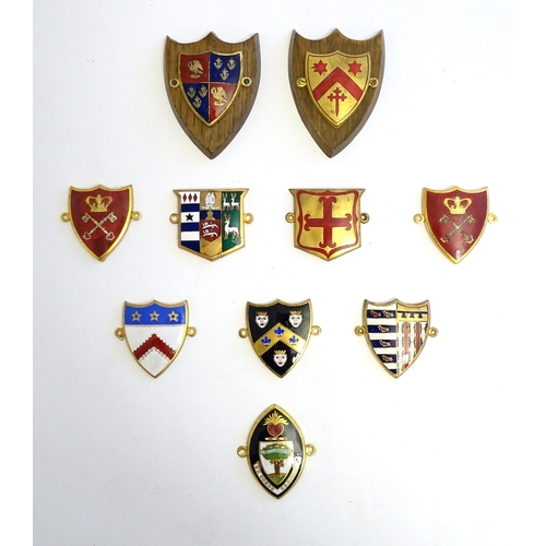 1232 - A collection of gilt metal enamelled collegiate insignia / badges, to include Keble College Oxford, ... 