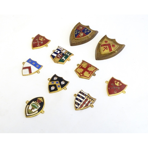 1232 - A collection of gilt metal enamelled collegiate insignia / badges, to include Keble College Oxford, ... 