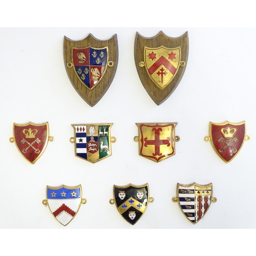 1232 - A collection of gilt metal enamelled collegiate insignia / badges, to include Keble College Oxford, ... 