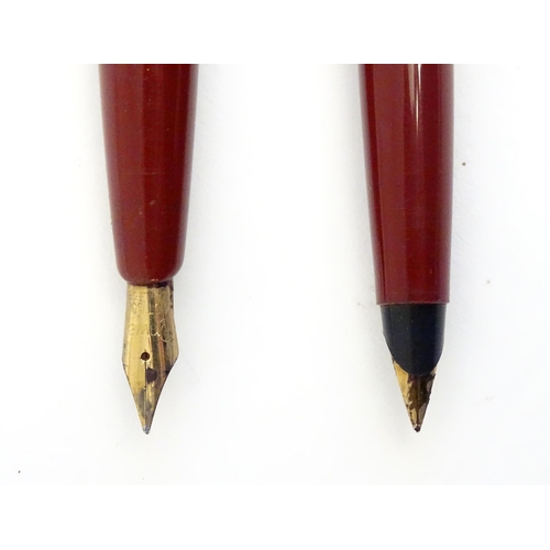 1239 - Two mid 20thC fountain pens, comprising a Conway 57 with 14ct gold nib, together with another by Par... 