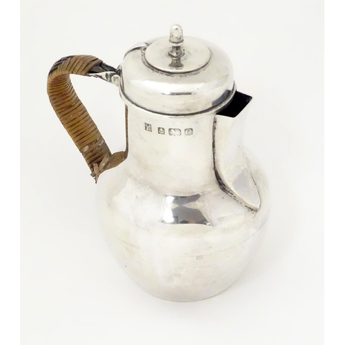 311 - An Edwardian silver hot water jug formed as a Channel Islands creamer, hallmarked Birmingham 1904, m... 