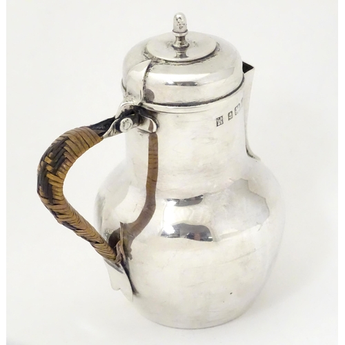 311 - An Edwardian silver hot water jug formed as a Channel Islands creamer, hallmarked Birmingham 1904, m... 