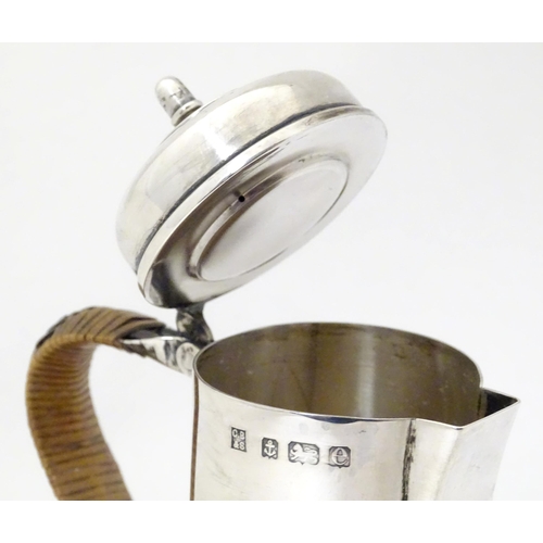 311 - An Edwardian silver hot water jug formed as a Channel Islands creamer, hallmarked Birmingham 1904, m... 