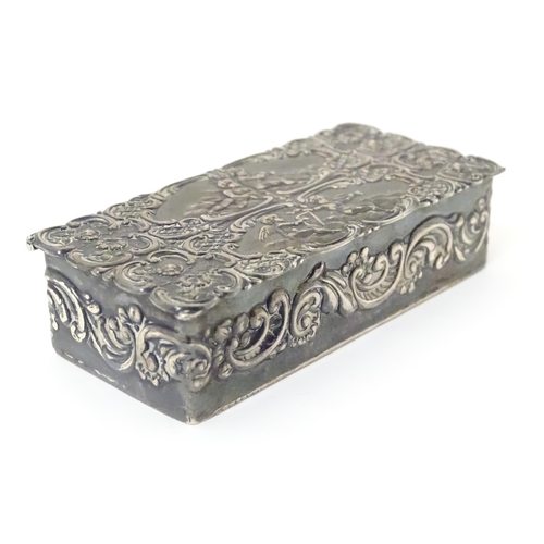 334 - A embossed silver box with a hinged lid opening to reveal a gilded interior, hallmarked London 1974,... 