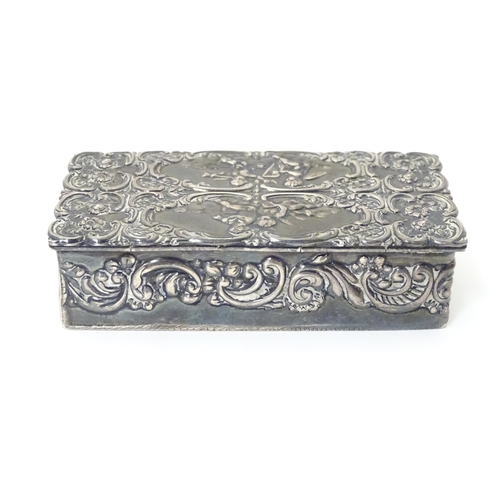 334 - A embossed silver box with a hinged lid opening to reveal a gilded interior, hallmarked London 1974,... 