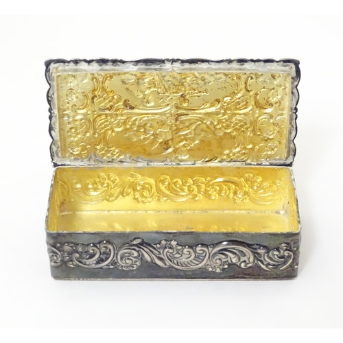 334 - A embossed silver box with a hinged lid opening to reveal a gilded interior, hallmarked London 1974,... 