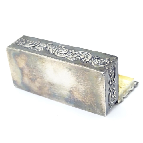 334 - A embossed silver box with a hinged lid opening to reveal a gilded interior, hallmarked London 1974,... 