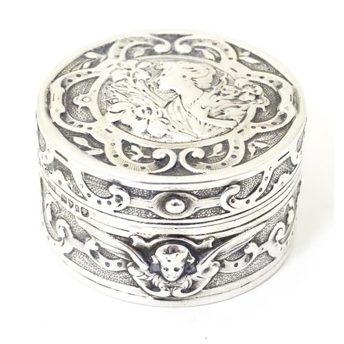 336 - An Art Nouveau silver box of circular form with hinged lid, with import mark and hallmark for Cheste... 