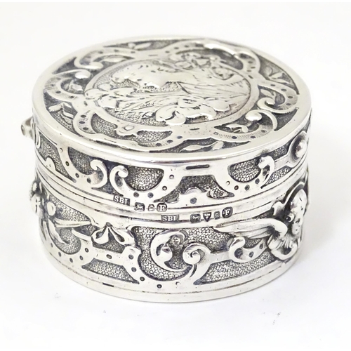 336 - An Art Nouveau silver box of circular form with hinged lid, with import mark and hallmark for Cheste... 