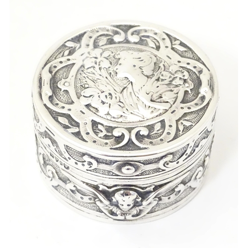 336 - An Art Nouveau silver box of circular form with hinged lid, with import mark and hallmark for Cheste... 