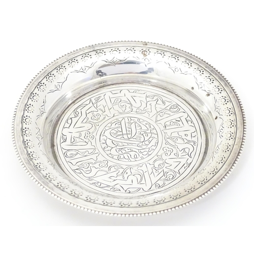 338 - An Egyptian silver dish with engraved decoration. Approx. 2 1/4