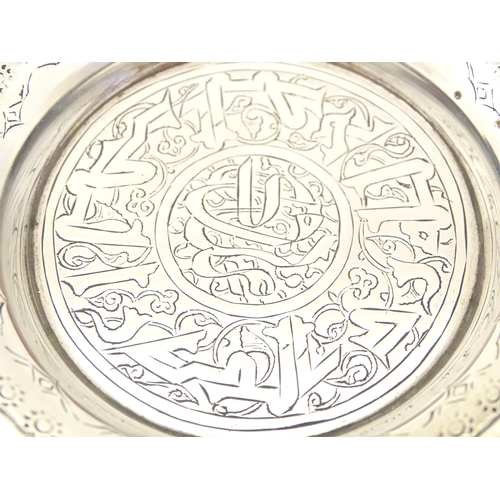 338 - An Egyptian silver dish with engraved decoration. Approx. 2 1/4