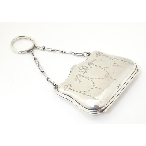 342 - A silver purse with engraved decoration and leather lined interior, hallmarked Birmingham 1914, make... 