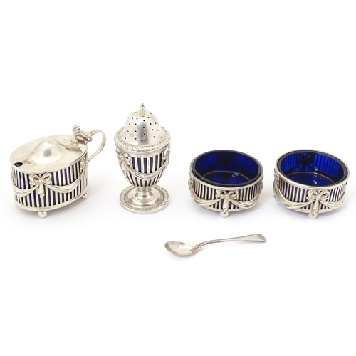 343 - A four piece silver cruet, comprising a pair of salts, mustard pot and pepperette, hallmarked London... 