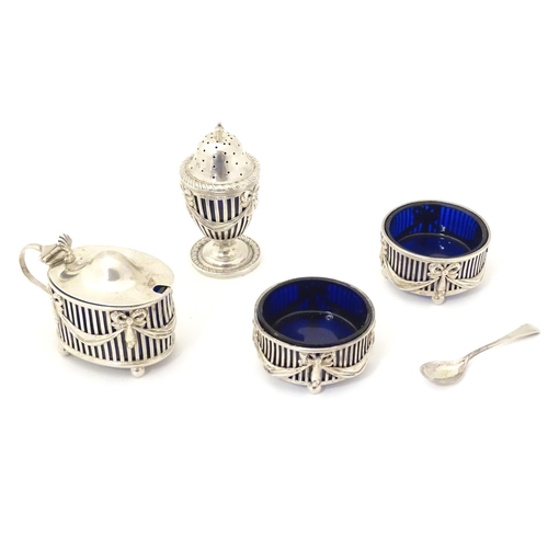 343 - A four piece silver cruet, comprising a pair of salts, mustard pot and pepperette, hallmarked London... 