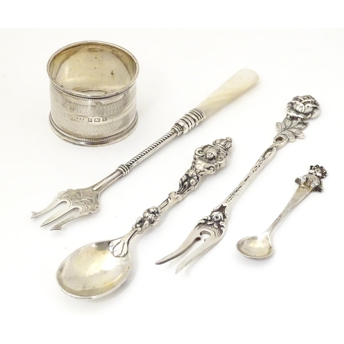 344 - Five assorted silver items to include a napkin ring, hallmarked Birmingham 1929, maker R. G. H., a s... 