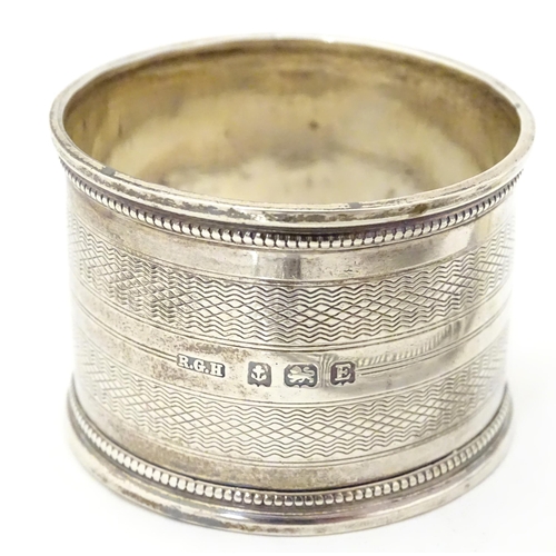 344 - Five assorted silver items to include a napkin ring, hallmarked Birmingham 1929, maker R. G. H., a s... 