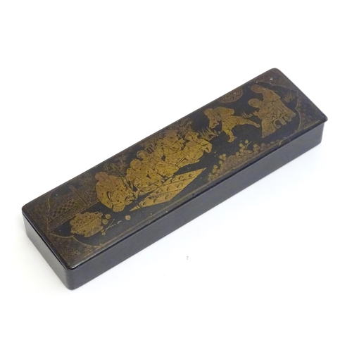 1164 - An early 20thC lacquered papier mache pen box decorated with a garden scene with Oriental figures pl... 