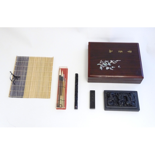 1165 - A late 20thC boxed Japanese calligraphy set, to include ink stone, brushes, brush rest etc. Box appr... 