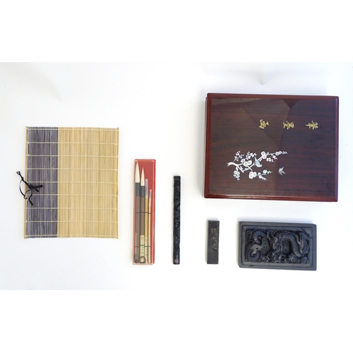 1165 - A late 20thC boxed Japanese calligraphy set, to include ink stone, brushes, brush rest etc. Box appr... 