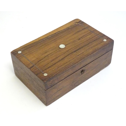 1168 - A late 19th / early 20thC walnut box with inlaid mother of pearl roundel detail to lid. Approx. 3 1/... 