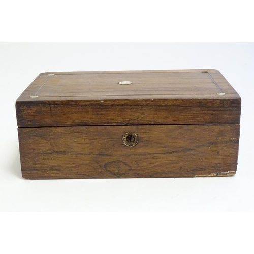 1168 - A late 19th / early 20thC walnut box with inlaid mother of pearl roundel detail to lid. Approx. 3 1/... 