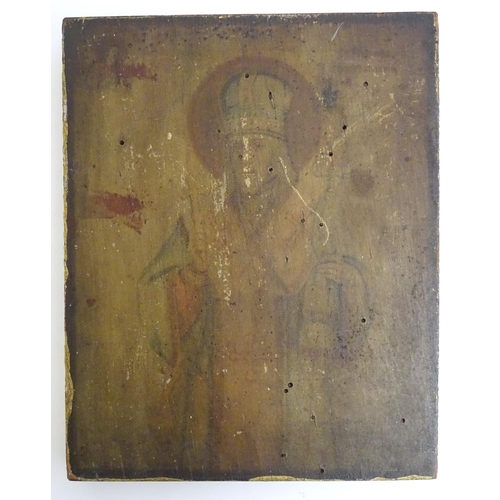 1173 - Two 19thC religious icons on panel, one depicting Jesus Christ, the other a saint, possibly St. Nich... 