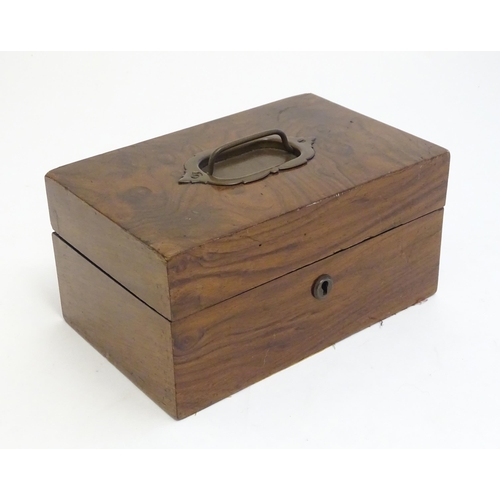 1183 - A late 19th / early 20thC walnut box with hinged lid and pull handle to top. Approx. 4 1/4