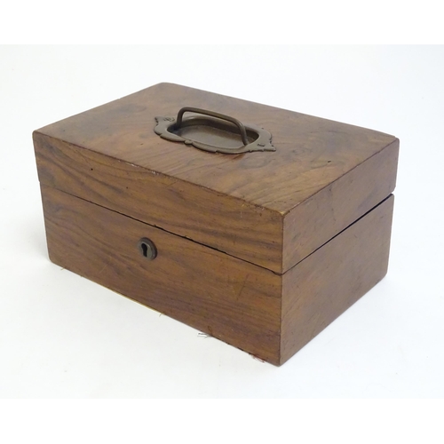 1183 - A late 19th / early 20thC walnut box with hinged lid and pull handle to top. Approx. 4 1/4