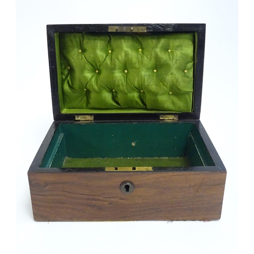 1183 - A late 19th / early 20thC walnut box with hinged lid and pull handle to top. Approx. 4 1/4