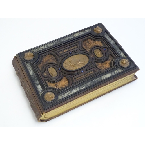 1185 - A late 19thC Austrian box formed as a book by Auguste Klein, the cover with inlaid carved panels dep... 