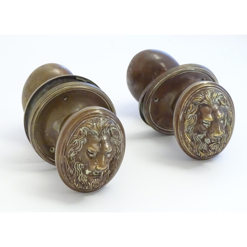 1256 - Two pairs of late 19th / early 20thC large brass door knobs / handles / door furniture with cast lio... 