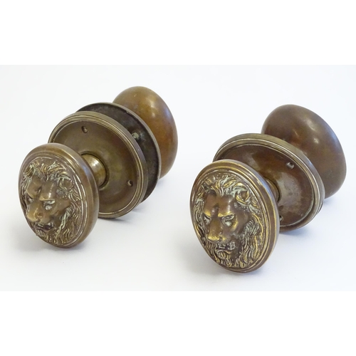 1256 - Two pairs of late 19th / early 20thC large brass door knobs / handles / door furniture with cast lio... 