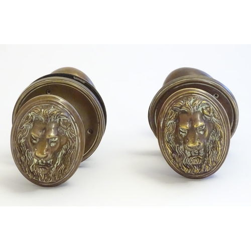 1256 - Two pairs of late 19th / early 20thC large brass door knobs / handles / door furniture with cast lio... 