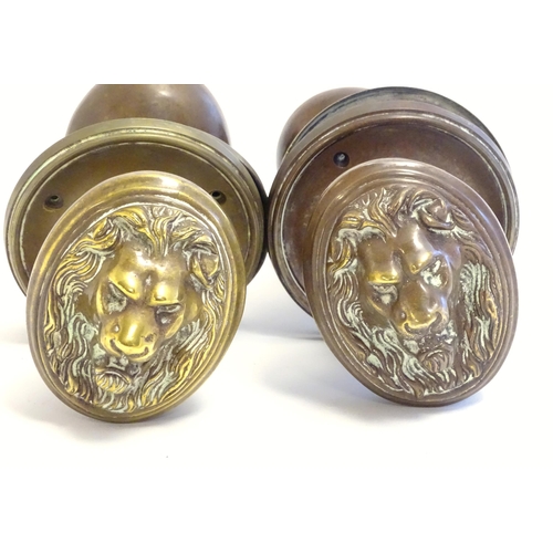 1256 - Two pairs of late 19th / early 20thC large brass door knobs / handles / door furniture with cast lio... 